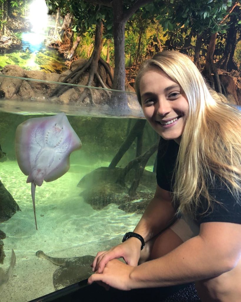 Jenkinson's Aquarium employee Taylor next to the stingray enclosure.