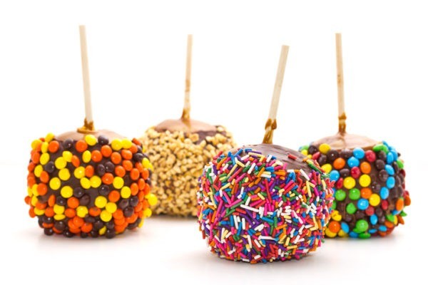 Caramel and Fudge Covered Apples with different toppings from Jenkinson's Sweet Shop.