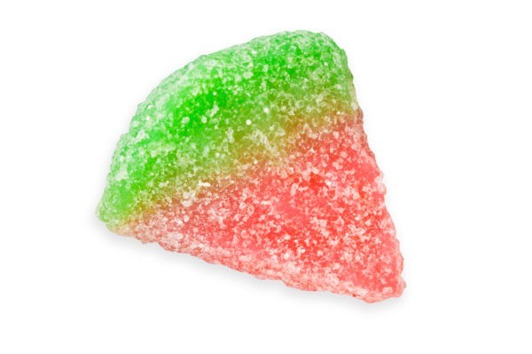 A single pink and green sour watermelon shaped gummy.