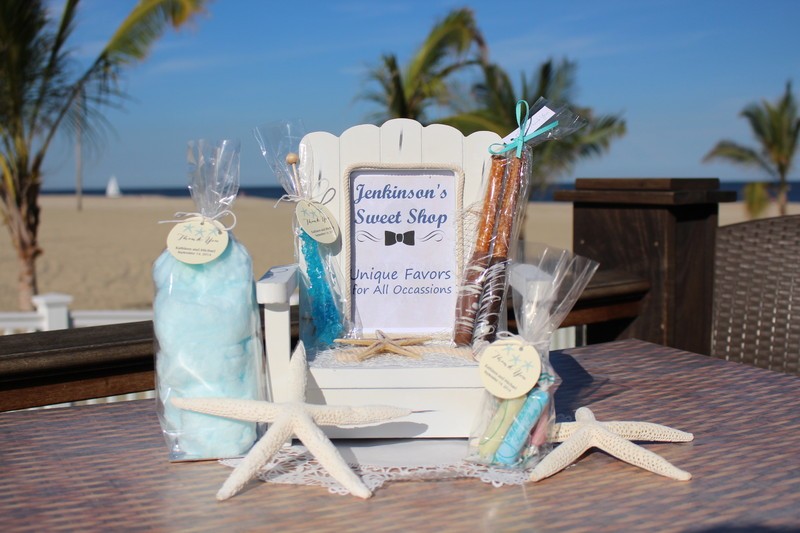 An assortment of special occasion favors displayed on the beach.