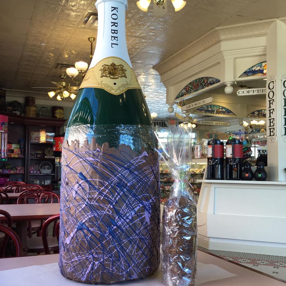 A giant chocolate dipped champagne bottle in Jenkinson's Sweet Shop.