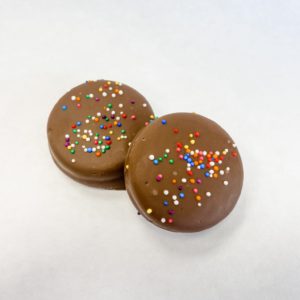 Nut Free milk chocolate covered Oreos with rainbow nonpareils.