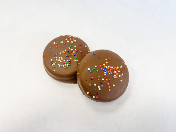 Nut free chocolate covered Oreos with rainbow nonpareils.