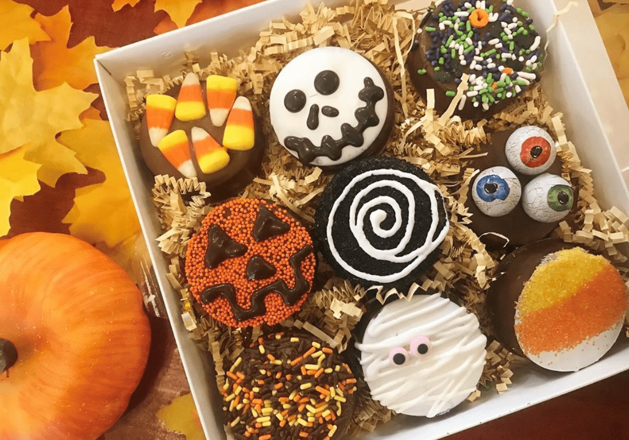 A Halloween inspired gift box filled with chocolate dipped Oreos.
