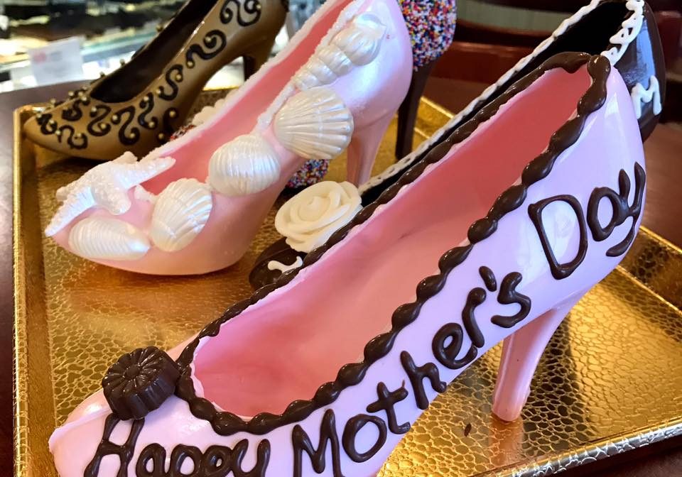 A display tray of Mother's day chocolate high heels.