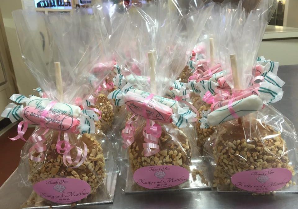 Custom special occasion favors that features taffy and caramel nut apples.
