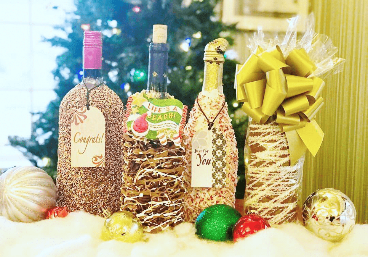 A display of chocolate dipped wine bottles decorated for Christmas inside Jenkinson's Sweet Shop.