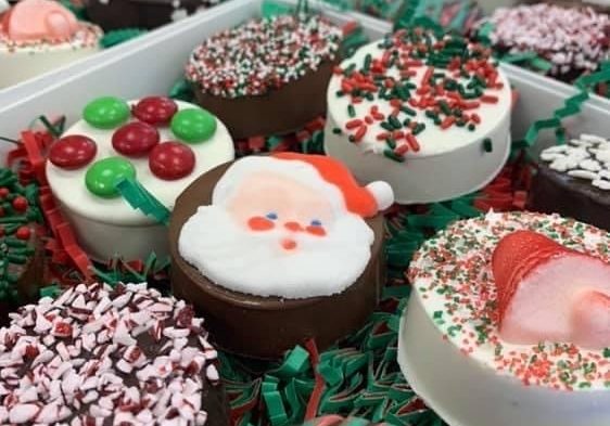 A gift box featuring Christmas themed chocolate covered Oreos.