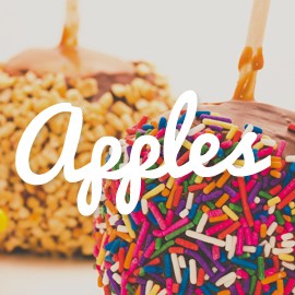 The word "Apples" with two candy apples from Jenk's Sweet Shop in the background.