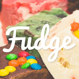 The word "Fudge" with different kinds of fudge in the background.