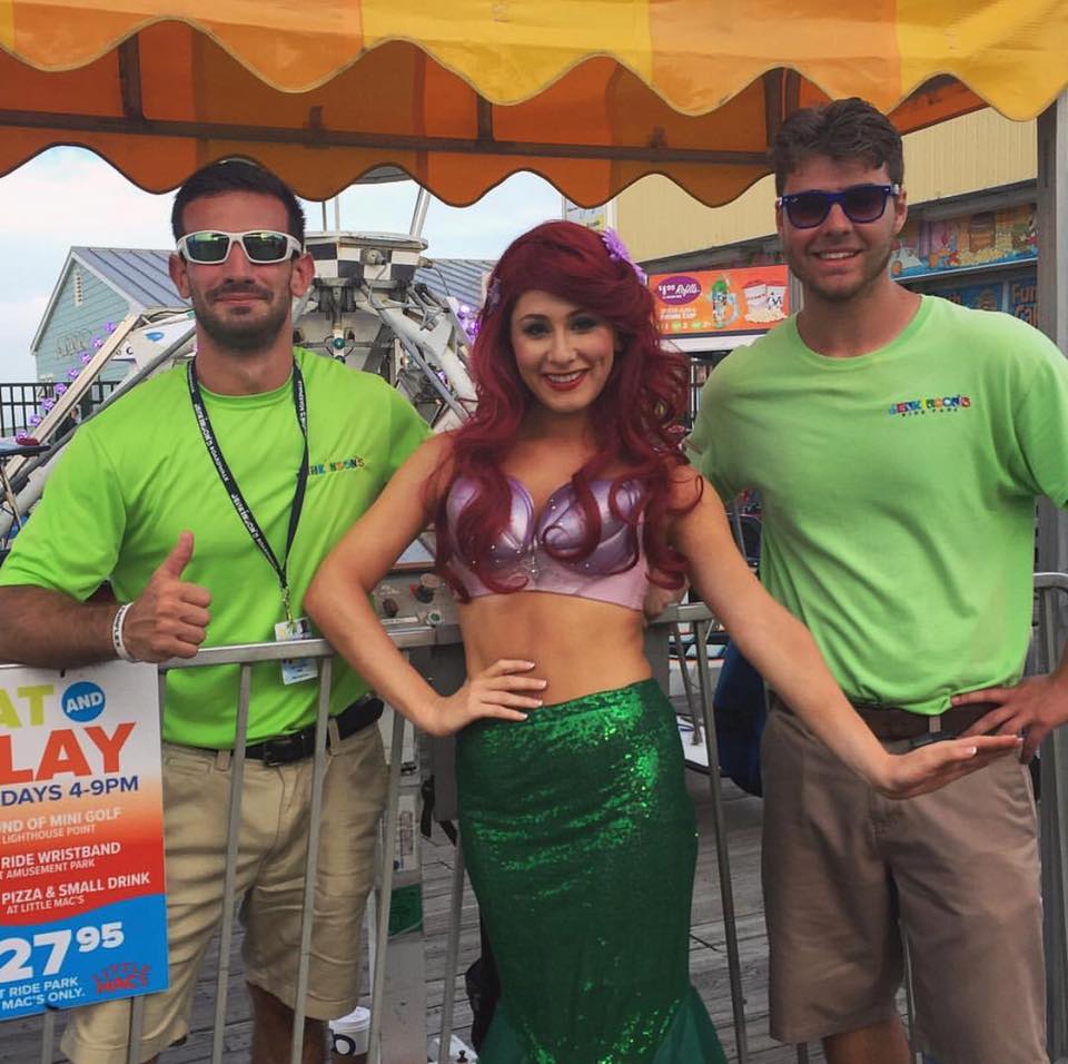 Ariel at Jenkinson's Boardwalk next to two other workers.