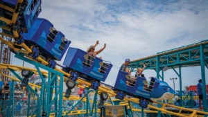 Riders enjoy new for 2022 Shark Escape ride at Jenkinson's Boardwalk. Riders throw their hands in the air in excitement