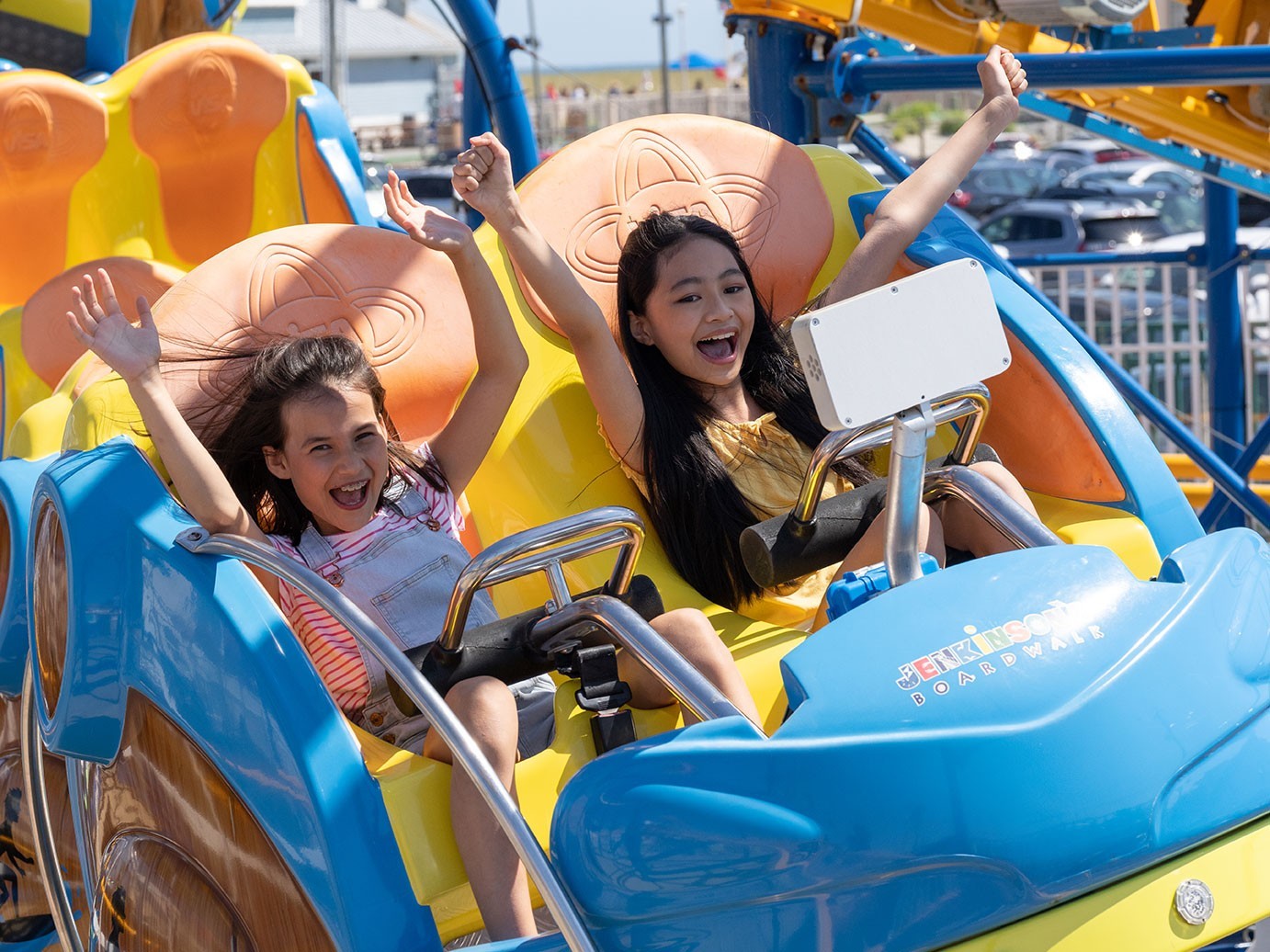 Kids riding Shark Escape roller coaster at Jenkinson's Amusement Park