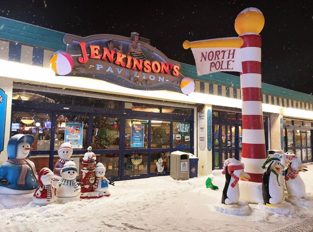 Front of restaurant with snow-covered statues.