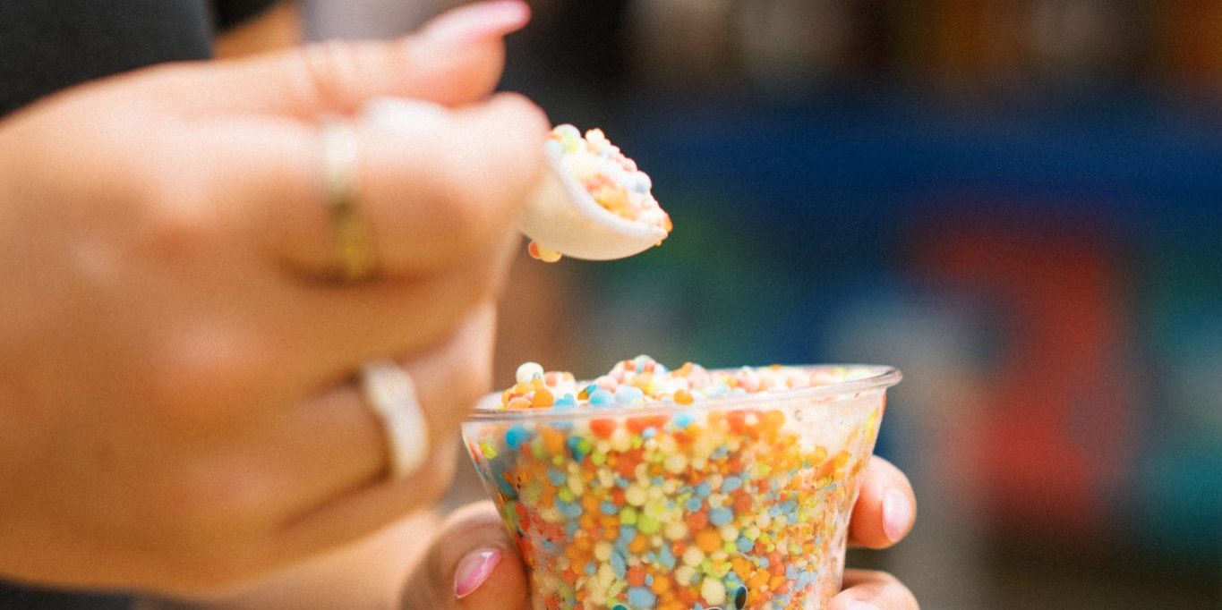 Customer eating Dipping Dots at Jenkinson's Amusement Park