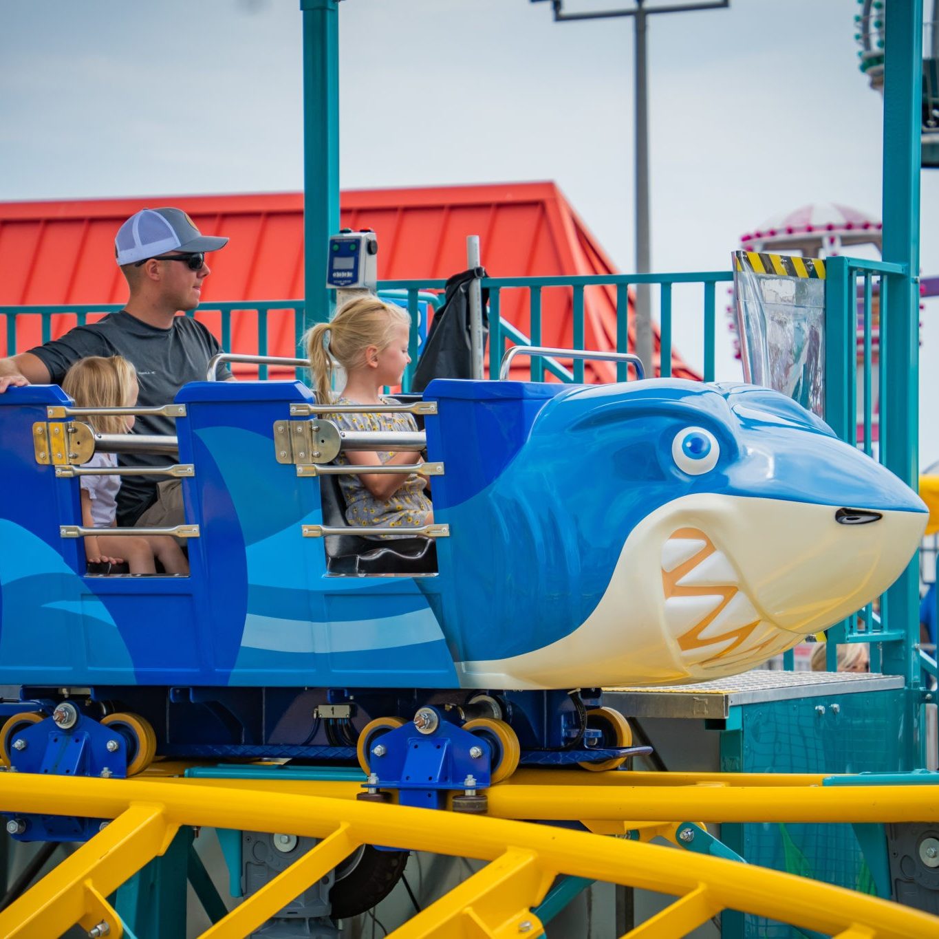 A family enjoys our new for 2022 Shark Escape Ride at Jenkinson's Boardwalk