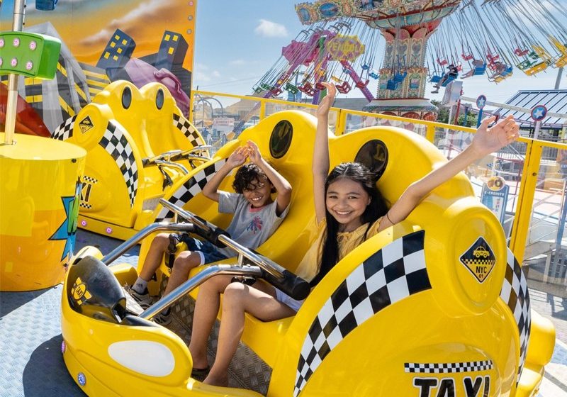 two children on the rides at jenkinson's boardwalk