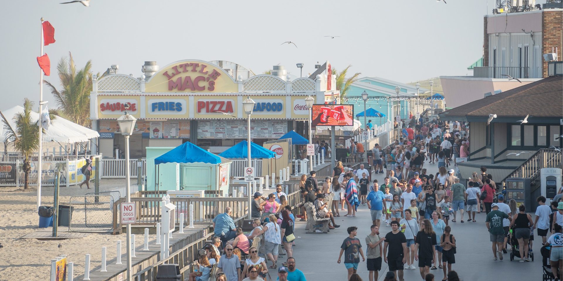 Crowds walking the Point Pleasant Beach boardwalk near Little Mac’s