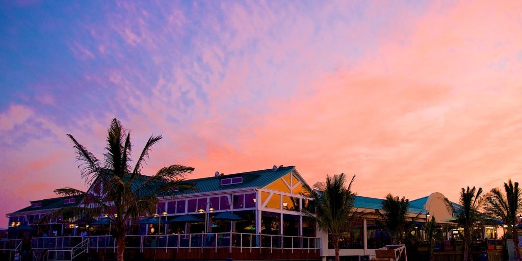 A shot of Jenkinson's Pavilion with a pink sunset in the background.