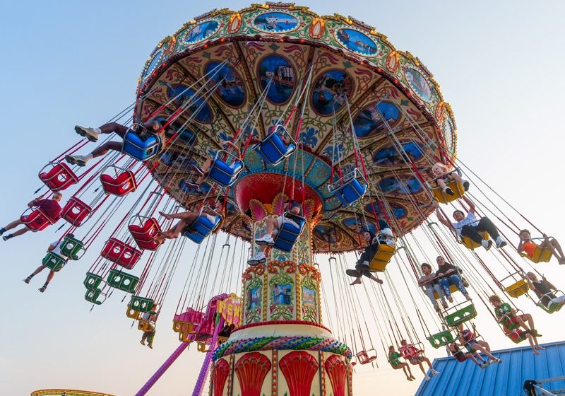 Guests riding the colorful swing ride at Jenkinson’s Boardwalk