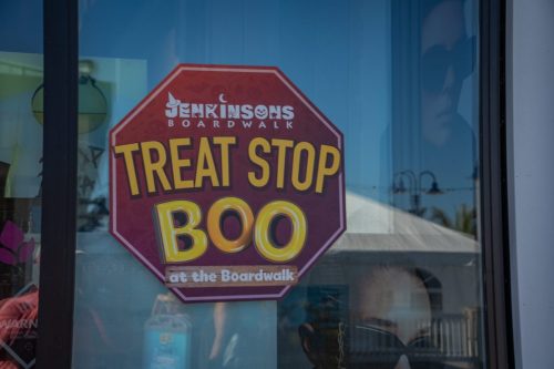 a stop sign that says Treat Stop for Boo at the Boardwalk at Jenkinson's Boardwalk